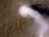 A Martian dust devil roughly 12 miles (20 kilometers) high was captured winding its way along the Amazonis Planitia region of Northern Mars on March 14, 2012 by the High Resolution Imaging Science Experiment (HiRISE) camera on NASA's Mars Reconnaissance Orbiter.