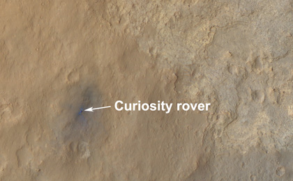 This color-enhanced view shows the terrain around the rover's landing site within Gale Crater on Mars.