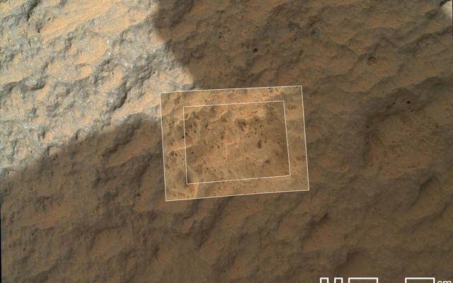 This image combines photographs taken by the Mars Hand Lens Imager (MAHLI) at three different distances from the first Martian rock that NASA's Curiosity rover touched with its arm.