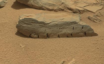 This view of a Martian rock called "Rocknest 3" combines four images taken by the right-eye camera of the Mast Camera (Mastcam) instrument, which has a telephoto, 100-millimeter-focal-length lens.