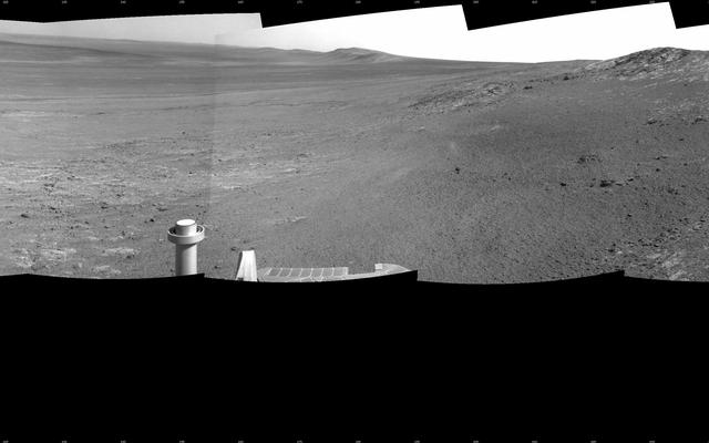 This full-circle panorama shows the terrain around the NASA Mars Exploration Rover Opportunity during the 3,105th Martian day, or sol, of the rover's work on Mars (Oct. 18, 2012).