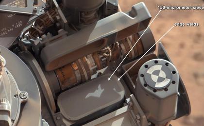 This image shows the location of the 150-micrometer sieve screen on NASA's Mars rover Curiosity, a device used to remove larger particles from samples before delivery to science instruments.