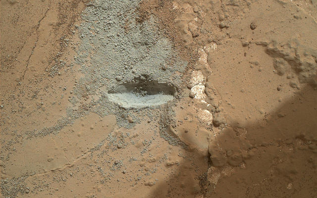 The bit in the rotary-percussion drill of NASA's Mars rover Curiosity left its mark in a target patch of rock called "John Klein" during a test on the rover's 176th Martian day, or sol (Feb. 2, 2013), in preparation for the first drilling of a rock by the rover.