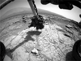 An animated set of three images from NASA's Curiosity rover shows the rover's drill in action on Feb. 8, 2013, or Sol 182, Curiosity's 182nd Martian day of operations.