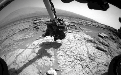 An animated set of three images from NASA's Curiosity rover shows the rover's drill in action on Feb. 8, 2013, or Sol 182, Curiosity's 182nd Martian day of operations.