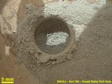 After an activity called the "mini drill test" by NASA's Mars rover Curiosity, the rover's Mars Hand Lens Imager (MAHLI) camera recorded this close-up view of the results during the 180th Martian day, or sol, of the rover's work on Mars (Feb. 6, 2013).