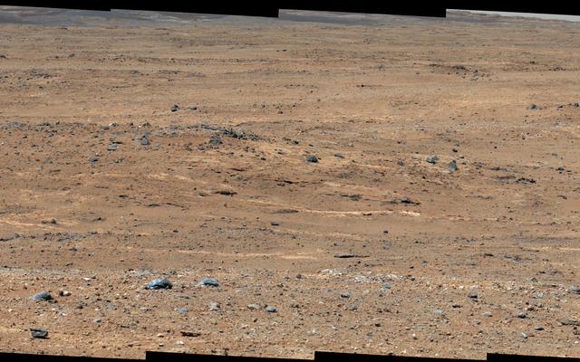 An outcrop visible as light-toned streaks in the lower center of this image has been chosen as a place for NASA's Mars rover Curiosity to study for a few days in September 2013.