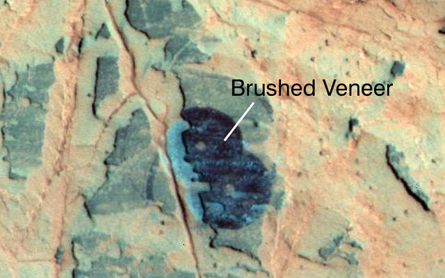 Researchers used NASA's Mars Exploration Rover Opportunity to find a water-related mineral on the ground that had been detected from orbit, and found it in the dark veneer of rocks on the rim of Endeavour Crater.