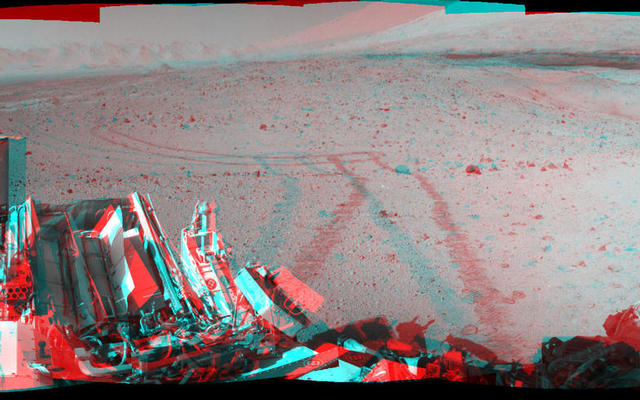 This stereo mosaic of images from the Navigation Camera (Navcam) on NASA's Mars rover Curiosity shows the terrain surrounding the rover's position on the 524th Martian day, or sol, of the mission (Jan. 26, 2014).