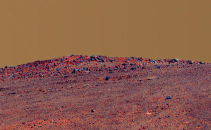 The boulder-studded ridge in this scene recorded by NASA's Mars Exploration Rover Opportunity is "McClure-Beverlin Escarpment," informally named for Jack Beverlin and Bill McClure, engineers who on Feb. 14, 1969, risked their lives to save NASA's second successful Mars mission, Mariner 6, on its launch pad.