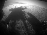 NASA's Mars Exploration Rover Opportunity caught its own silhouette in this late-afternoon image taken by the rover's rear hazard avoidance camera on March 20, 2014.