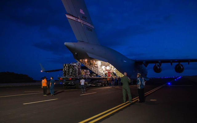 Engineers unload ground support equipment for a June engineering test flight above Kauai, Hawaii.