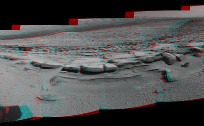 This March 18, 2014, stereo view from NASA's Curiosity Mars rover spans 160 degrees, centered southward, with an outcrop of eroded sandstone in the foreground. It appears three dimensional when viewed through red-blue glasses with the red lens on the left.
