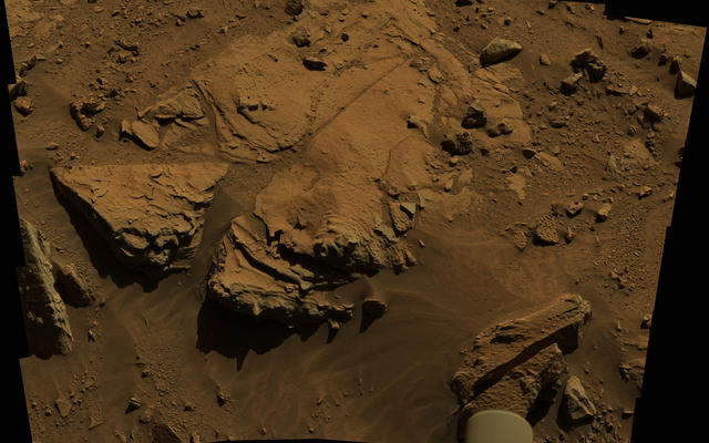 NASA's Curiosity Mars rover has driven within robotic-arm's reach of the sandstone slab at the center of this April 23 view from the rover's Mast Camera.