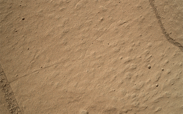 This two-step animation shows before and after views of a patch of sandstone scrubbed with the Dust Removal Tool, a wire-bristle brush, on NASA's Curiosity Mars rover.