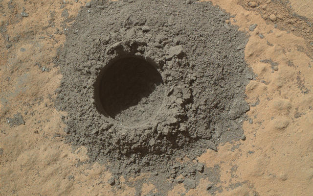 This image from Curiosity's Mars Hand Lens Imager shows the hole resulting from the test, 0.63 inch across and about 0.8 inch deep.