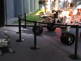 A 3D, augmented reality model of NASA's Curiosity rover shares a scene with a real life model of the rover in a view taken with NASA's Spacecraft 3D app.