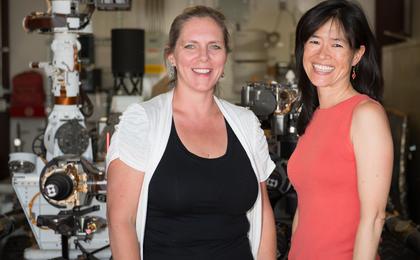 Pictured here are Jennifer Trosper, MSL Deputy Project Manager and Grace Tan-Wang, Strategic Uplink Lead.  The image was taken in the "Mars Yard" where the ground test model of the Curiosity rover is housed.