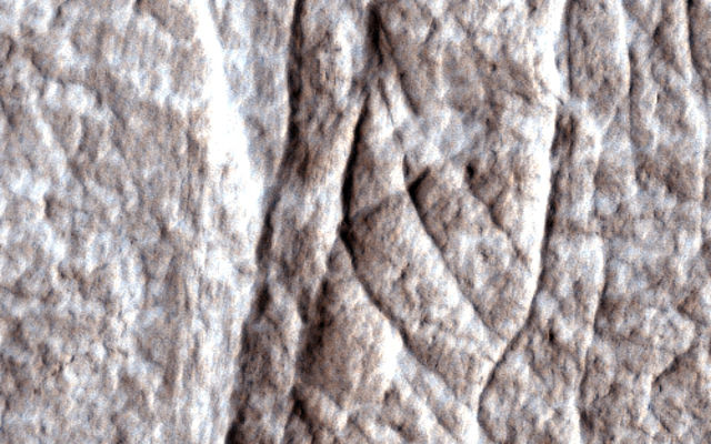 Dense clusters of crack-like structures called deformation bands form the linear ridges prominent in this image from the High Resolution Imaging Science Experiment (HiRISE) camera on NASA's Mars Reconnaissance Orbiter.