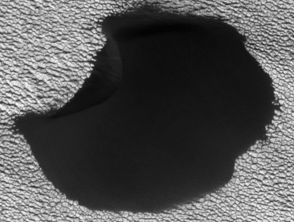 A dune in the northern polar region of Mars shows significant changes between two images taken on June 25, 2008 and May 21, 2010 by NASA's Mars Reconnaissance Orbiter.