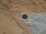 NASA's Curiosity Mars Rover drilled this hole to collect sample material from a rock target called "Buckskin" on July 30, 2015, about a week prior to the third anniversary of the rover's landing on Mars. The diameter is slightly smaller than a U.S. dime.
