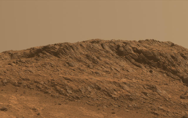 This Martian scene shows contrasting textures and colors of "Hinners Point," at the northern edge of "Marathon Valley," and swirling reddish zones on the valley floor to the left.
