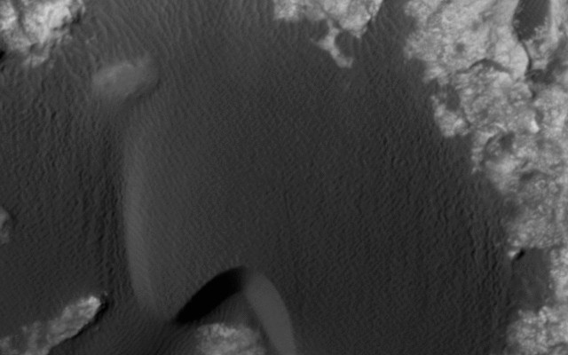 This animation flips back and forth between views taken in 2010 and 2014 of a Martian sand dune at the edge of Mount Sharp, documenting dune activity. The images are from the HiRISE camera on NASA's Mars Reconnaissance Orbiter.