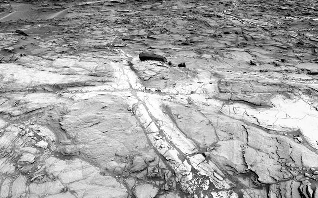 This view from NASA's Curiosity Mars rover shows an example of discoloration closely linked to fractures in the Stimson formation sandstone on lower Mount Sharp.