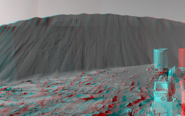 This stereo view from NASA's Curiosity Mars Rover shows the downwind side of a dune about 13 feet high within the Bagnold Dunes on Mars. The image appears three-dimensional when viewed through red-blue glasses with the red lens on the left. Curiosity's Navcam took the component images on Dec. 17, 2015.