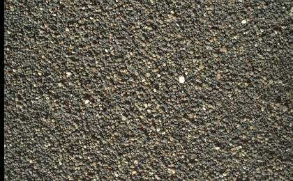 This Dec. 5, 2015, view of the undisturbed surface of a Martian sand dune called "High Dune" shows coarse grains remaining on the surface after wind removal of smaller particles. The image covers an area 1.4 inches across. It was taken by the rover's Mars Hand Lens Imager (MAHLI).
