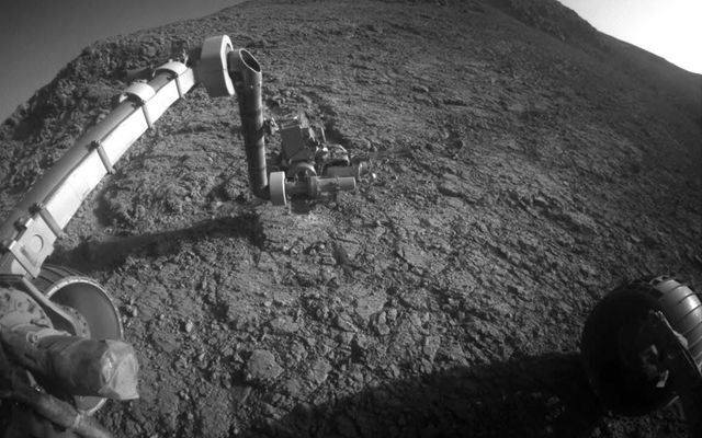 The target beneath the tool turret at the end of the rover's robotic arm in this image from NASA's Mars Exploration Rover Opportunity is "Private John Potts." It lies high on the southern side of "Marathon Valley," which slices through the western rim of Endeavour Crater.