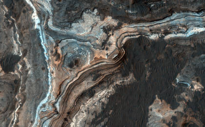 This image shows part of Ladon Vallis, a long outflow channel found in the Southern Highlands on Mars.