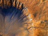 This impact crater appears relatively recent as it has a sharp rim and well-preserved ejecta, the material thrown out of the crater when a meteorite hit Mars.