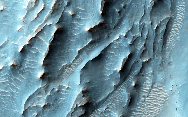 NASA's Mars Reconnaissance Orbiter, nearing the 10th anniversary of its arrival at Mars, used its High Resolution Imaging Science Experiment (HiRISE) camera to obtain this view of an area with unusual texture on the southern floor of Gale Crater.