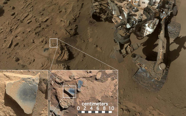 This scene shows NASA's Curiosity Mars rover at a location called "Windjana," where the rover found rocks containing manganese-oxide minerals, which require abundant water and strongly oxidizing conditions to form.