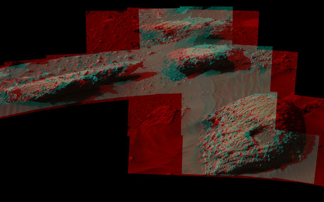 This July 22, 2016, stereo scene from the Mastcam on NASA's Curiosity Mars Rover shows boulders at a site called "Bimbe" on lower Mount Sharp. They contain pebble-size and larger rock fragments. The image appears three dimensional when viewed through red-blue glasses with the red lens on the left.