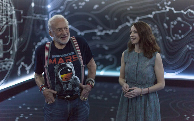 Apollo 11 astronaut Buzz Aldrin, left, and Erisa Hines of NASA's Jet Propulsion Laboratory in Pasadena, California, speak to members of the news media during a preview of the new "Destination: Mars" experience at the Kennedy Space Center visitor complex in Florida.