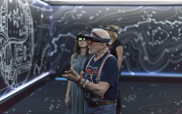 Apollo 11 astronaut Buzz Aldrin, right, and Erisa Hines of NASA's Jet Propulsion Laboratory in Pasadena, California, try out the Microsoft Hololens mixed reality headset during a preview of "Destination: Mars" at Kennedy Space Center visitor complex in Florida.