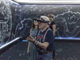 Apollo 11 astronaut Buzz Aldrin, right, and Erisa Hines of NASA's Jet Propulsion Laboratory in Pasadena, California, try out the Microsoft Hololens mixed reality headset during a preview of "Destination: Mars" at Kennedy Space Center visitor complex in Florida.
