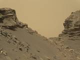 Curiosity viewed sloping buttes and layered outcrops as it exited the "Murray Buttes" region on lower Mount Sharp, Sept. 9, 2016.