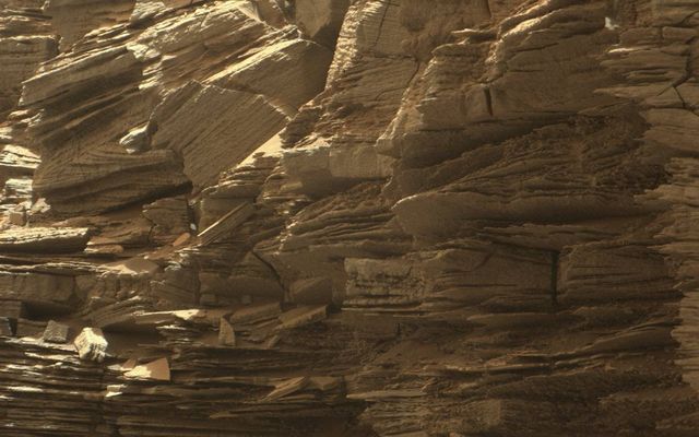This closeup view from NASA's Curiosity rover shows finely layered rocks, deposited by wind long ago as migrating sand dunes.
