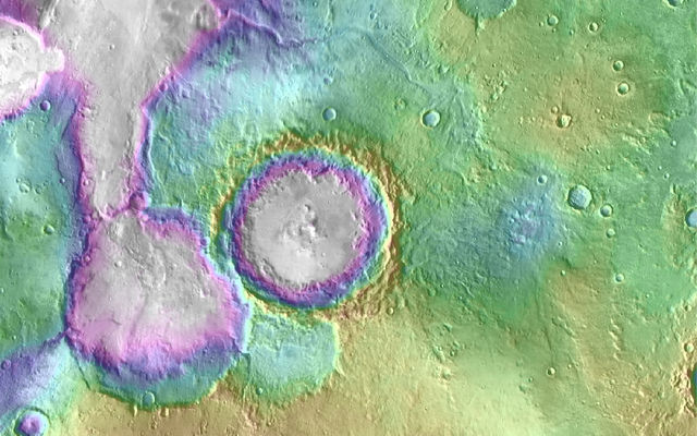 Valleys much younger than well-known ancient valley networks on Mars are evident near the informally named "Heart Lake" on Mars. This map presents color-coded topographical information overlaid onto a photo mosaic. Lower elevations are indicated with white and purple; higher elevations, yellow.