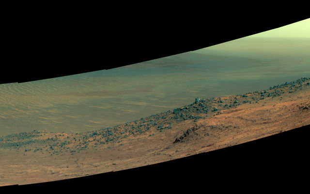 This scene from NASA's Mars rover Opportunity shows "Wharton Ridge," on the western rim of Endeavour Crater. The ridge's name honors the memory of astrobiologist Robert A. Wharton (1951-2012). The scene is presented in enhanced color to make differences in surface materials more easily visible.