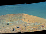 This Sept. 21, 2016, scene from the panoramic camera (Pancam) on NASA's Mars Exploration Rover Opportunity shows "Spirit Mound" overlooking the floor of Endeavour Crater. The mound stands near the eastern end of "Bitterroot Valley" on the western rim of the crater, and this view faces eastward.