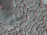 This stereo view shows an area on Mars where narrow rock ridges intersect at angles forming corners of polygons. It combines two observations from the HiRISE camera on NASA's Mars Reconnaissance Orbiter and appears three-dimensional when viewed through red-blue glasses with the red lens on the left.