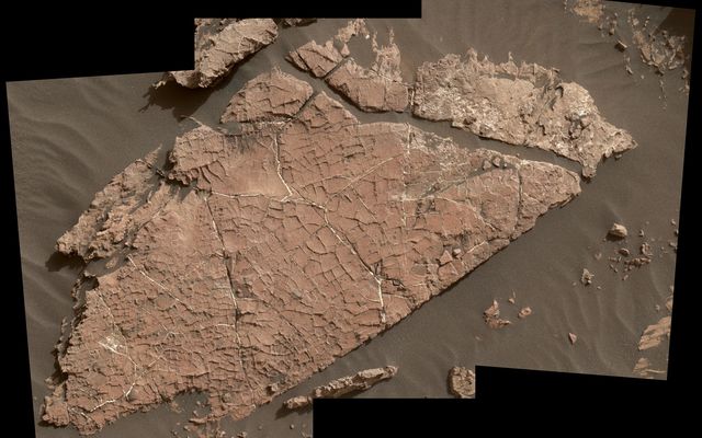 The network of cracks in this Martian rock slab called "Old Soaker" may have formed from the drying of a mud layer more than 3 billion years ago. The view spans about 3 feet (90 centimeters) left-to-right and combines three images taken by the MAHLI camera on the arm of NASA's Curiosity Mars rover.
