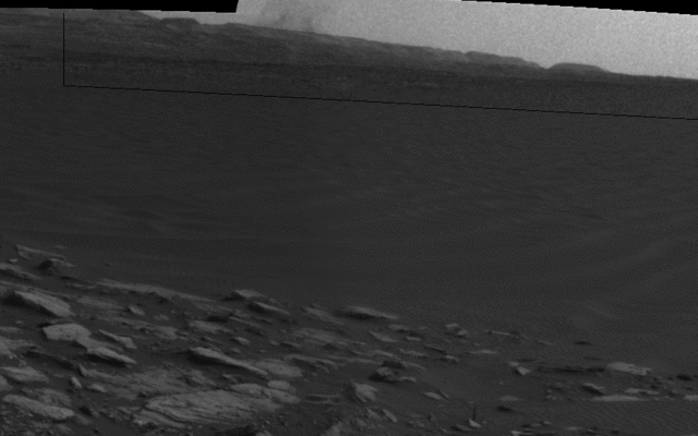 Beyond a dark sand dune closer to the rover, a Martian dust devil passes in front of the horizon in this sequence of images from NASA's Curiosity Mars rover. The rover's Navigation Camera made this series of observations on Feb. 4, 2017, during the local afternoon in Mars' Gale Crater.