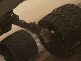 Two of the raised treads, called grousers, on the left middle wheel of NASA's Curiosity Mars rover broke during the first quarter of 2017, including the one seen partially detached at the top of the wheel in this image from the Mars Hand Lens Imager (MAHLI) camera on the rover's arm.