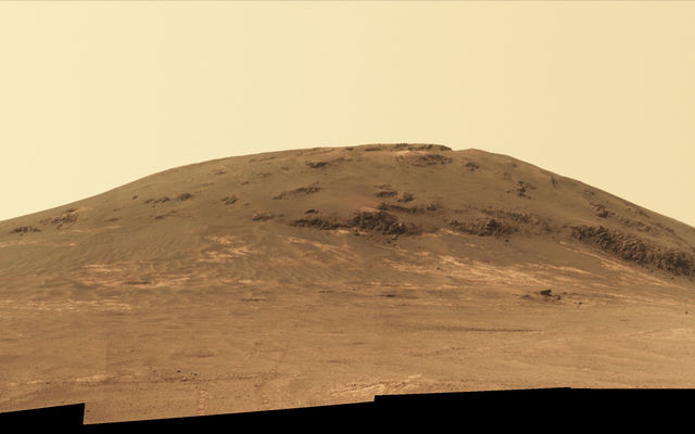 Wheel tracks from NASA's Mars rover Opportunity descending and departing the "Cape Tribulation" segment of Endeavour Crater's rim are visible in this April 21, 2017, view from the rover's Panoramic Camera (Pancam). The rover looked back northward during its trek south to "Perseverance Valley."