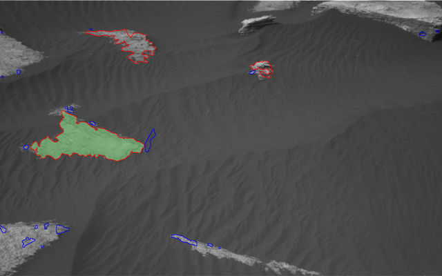 This is how AEGIS sees the Martian surface. All targets found by the A.I. program are outlined: blue targets are rejected, while red are retained. The top-ranked target is shaded green; if there's a second-ranked target, it's shaded orange. These NavCam images have been contrast-balanced.